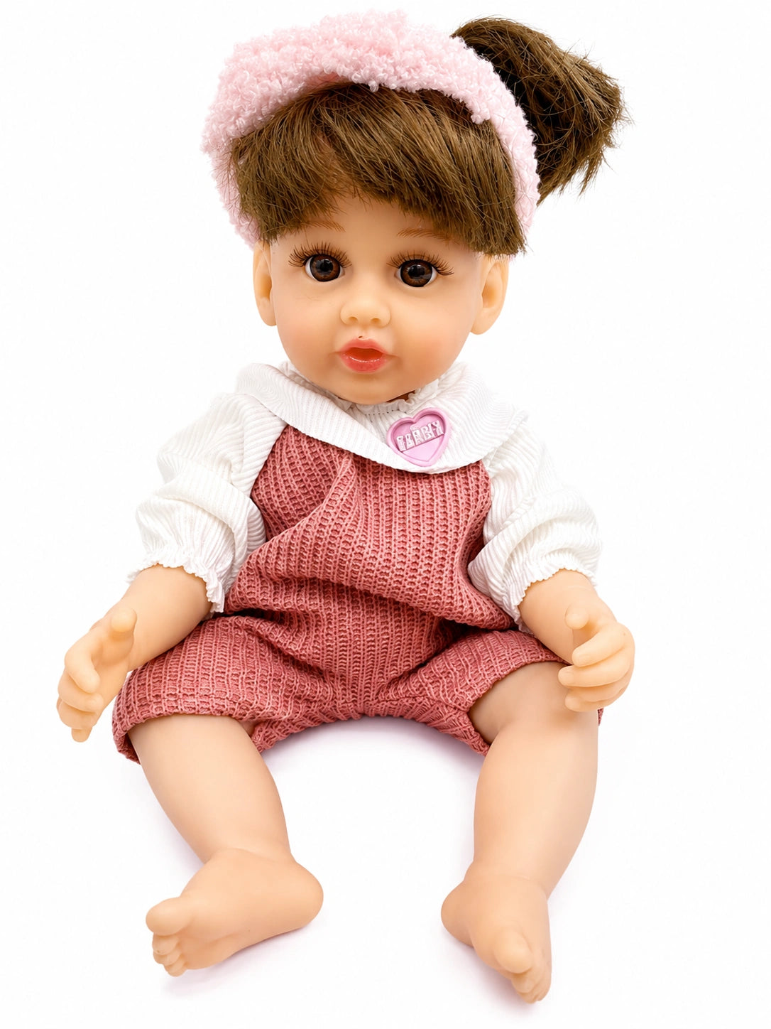Cute baby doll toy with pink outfit, soft headband, and white background from Toy Trendz JJR Mart.