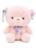Soft pink teddy bear plush toy with ribbon bow for kids