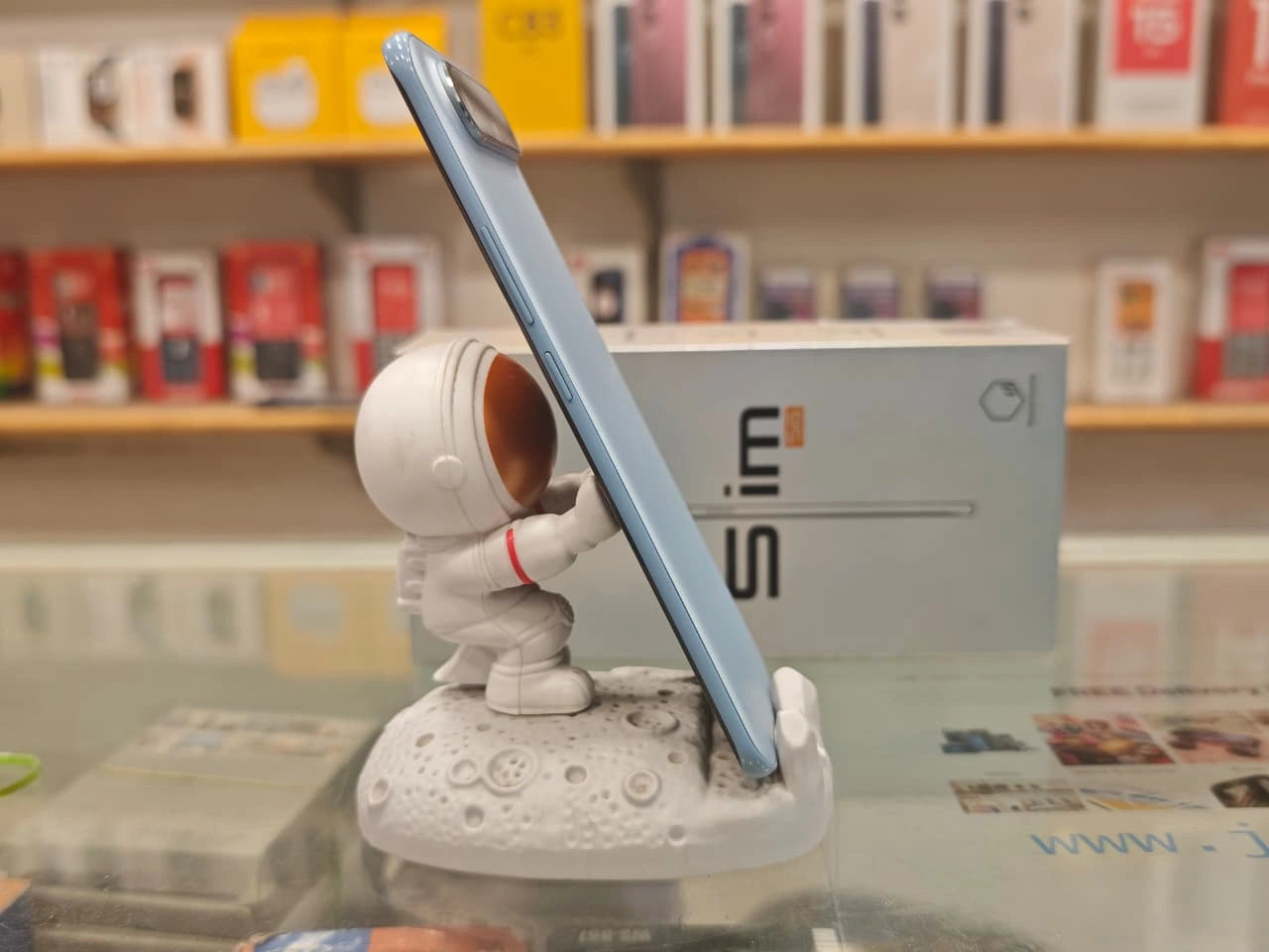 TECNO POVA Slim 5G Sky Blue smartphone front and back view with curved AMOLED display and dual camera setup at JJR Mobiles JJRMart.