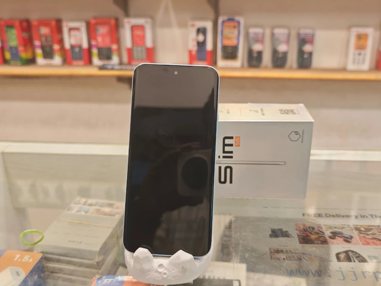 TECNO POVA Slim 5G Sky Blue smartphone front and back view with curved AMOLED display and dual camera setup at JJR Mobiles JJRMart.