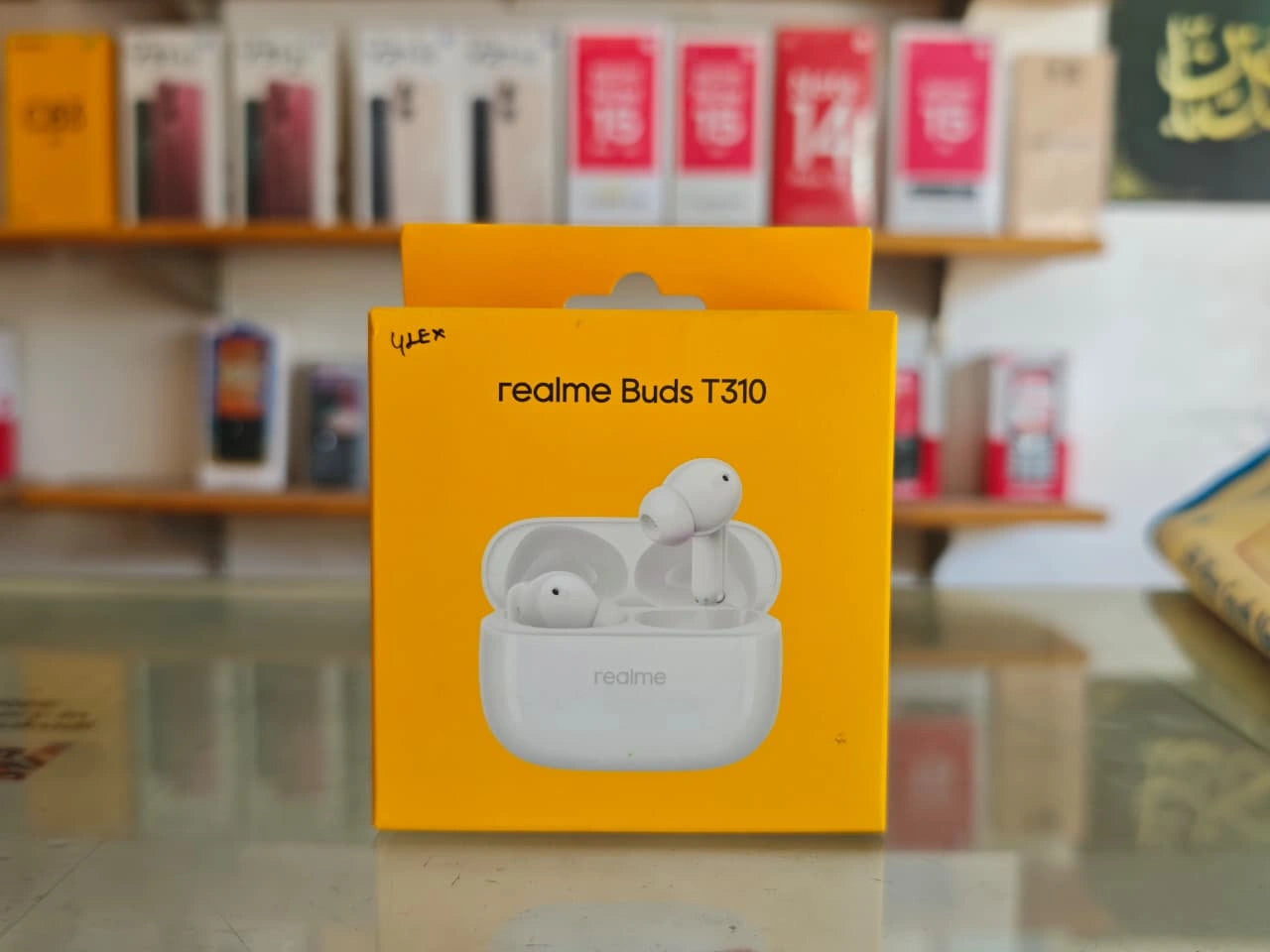 realme Buds T310 white wireless earbuds retail box displayed at JJR Mobiles showroom