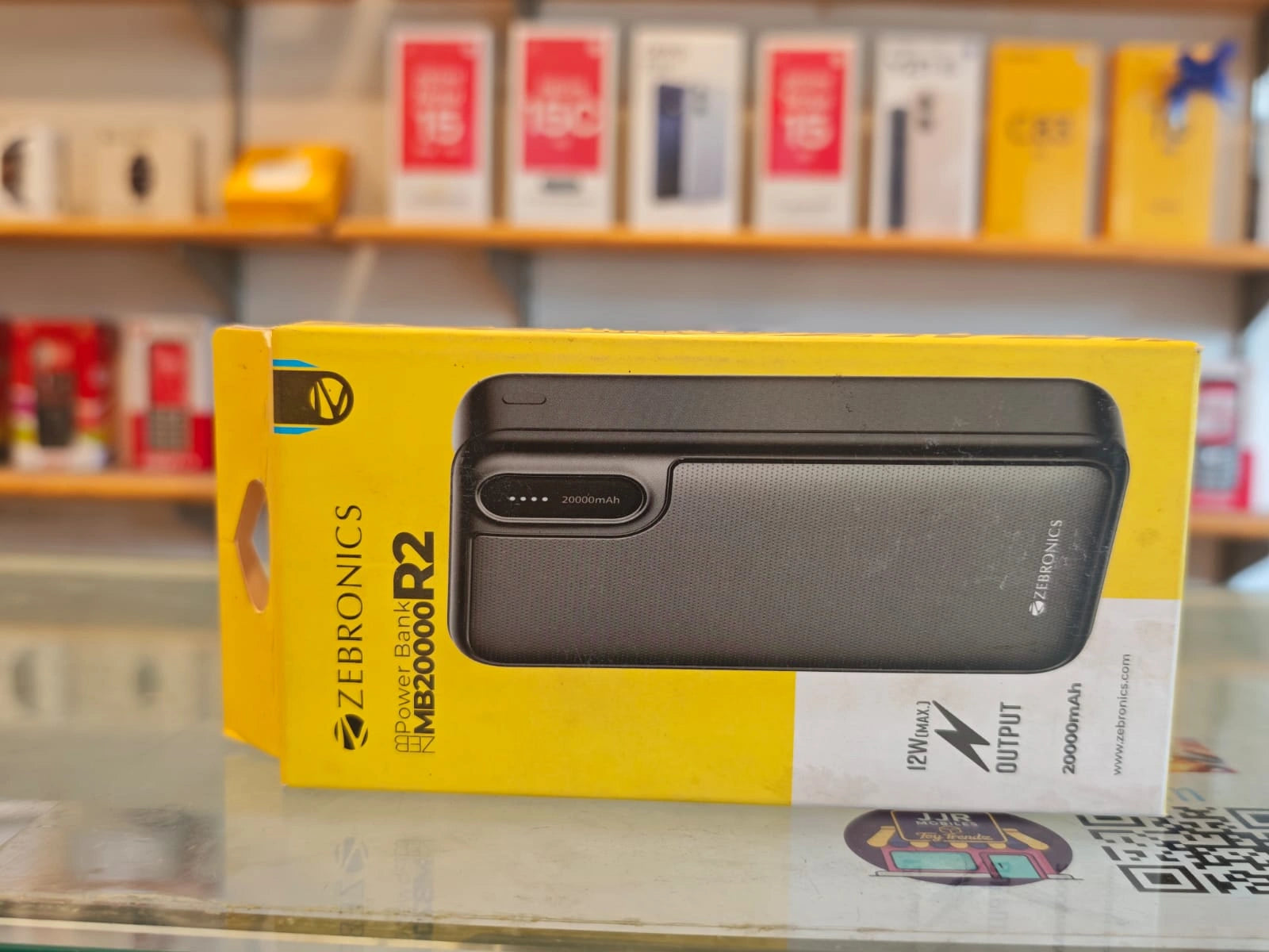 Zebronics MB20000 R2 20000mAh power bank with dual USB output, 12W fast charging and LED indication in premium retail packaging.