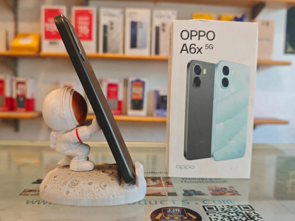 OPPO A6x 5G smartphone in brown finish displayed beside retail box showcasing stylish design, dual AI camera setup, and 5G connectivity.