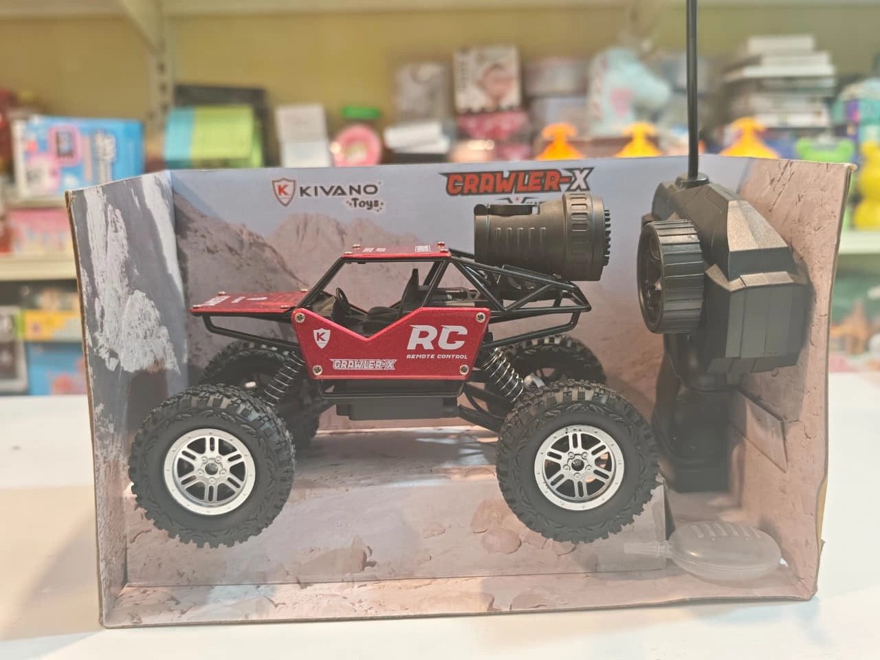 Kivano Crawler-X 1:18 Scale RC Rock Crawler Car with spray smoke effect, alloy body, oversized off-road tyres, suspension system and remote control available at Toy Trendz by JJR Mart Thoothukudi.