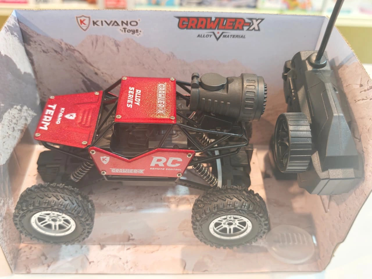 Kivano Crawler-X 1:18 Scale RC Rock Crawler Car with spray smoke effect, alloy body, oversized off-road tyres, suspension system and remote control available at Toy Trendz by JJR Mart Thoothukudi.