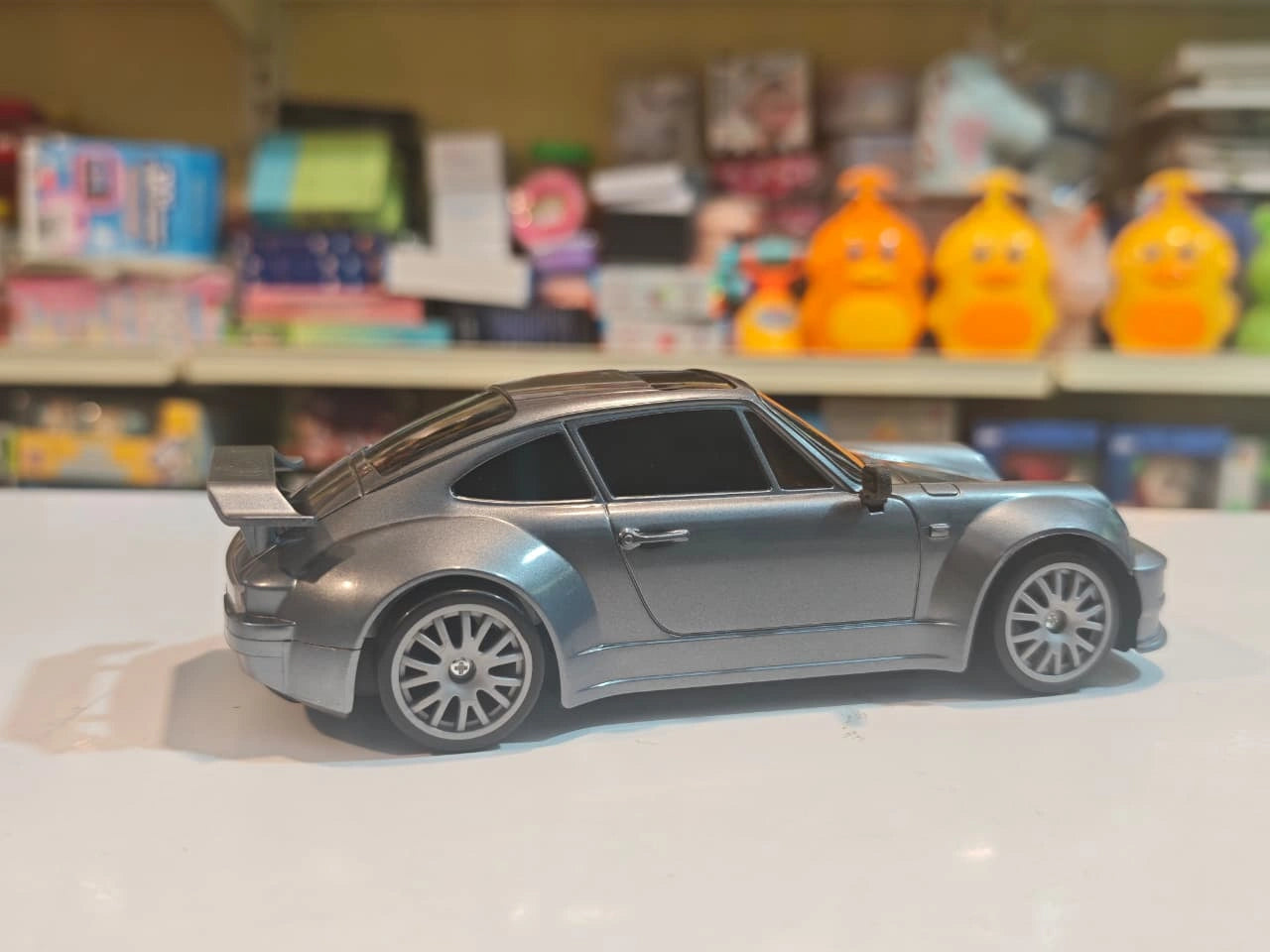High-Speed Drift Racing RC Car with remote control, rechargeable battery, extra drift wheels, traffic cones and racing stickers available at Toy Trendz by JJR Mart Thoothukudi.