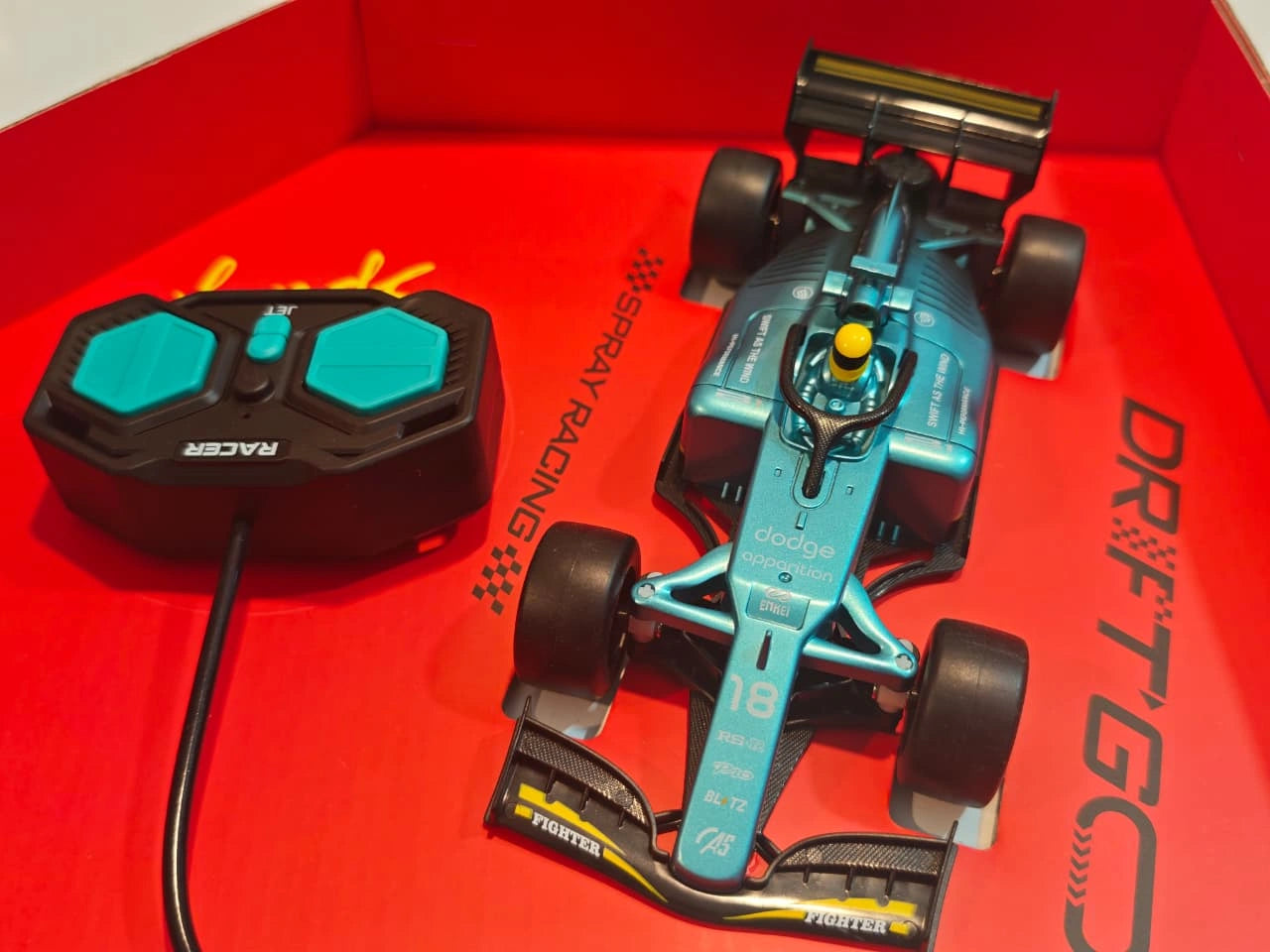 ToyBoi 1:18 Scale Formula Style RC Racing Car with spray smoke effect, LED lights, remote control and rechargeable battery available at Toy Trendz by JJR Mart Thoothukudi.