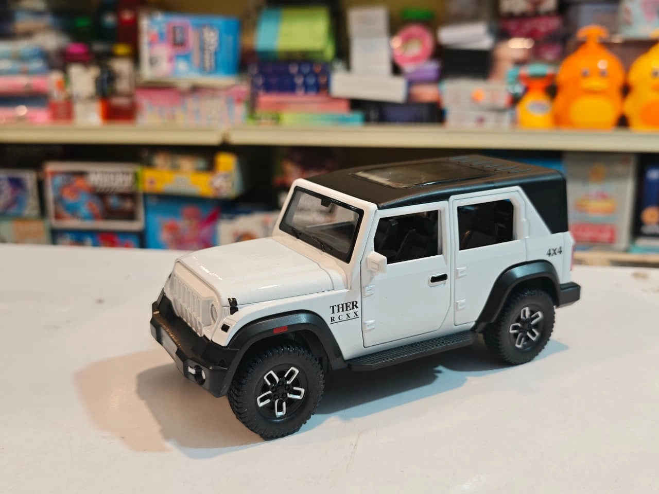 ThaarR Roxx 1:22 scale remote control 4x4 SUV with smoke spray effect, LED lights, opening doors and bonnet available at Toy Trendz by JJR Mart.