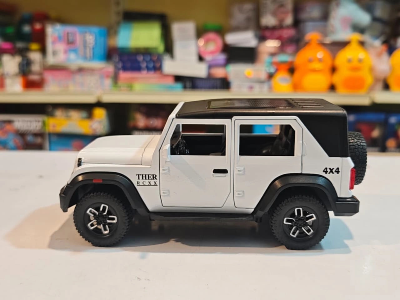 ThaarR Roxx 1:22 scale remote control 4x4 SUV with smoke spray effect, LED lights, opening doors and bonnet available at Toy Trendz by JJR Mart.
