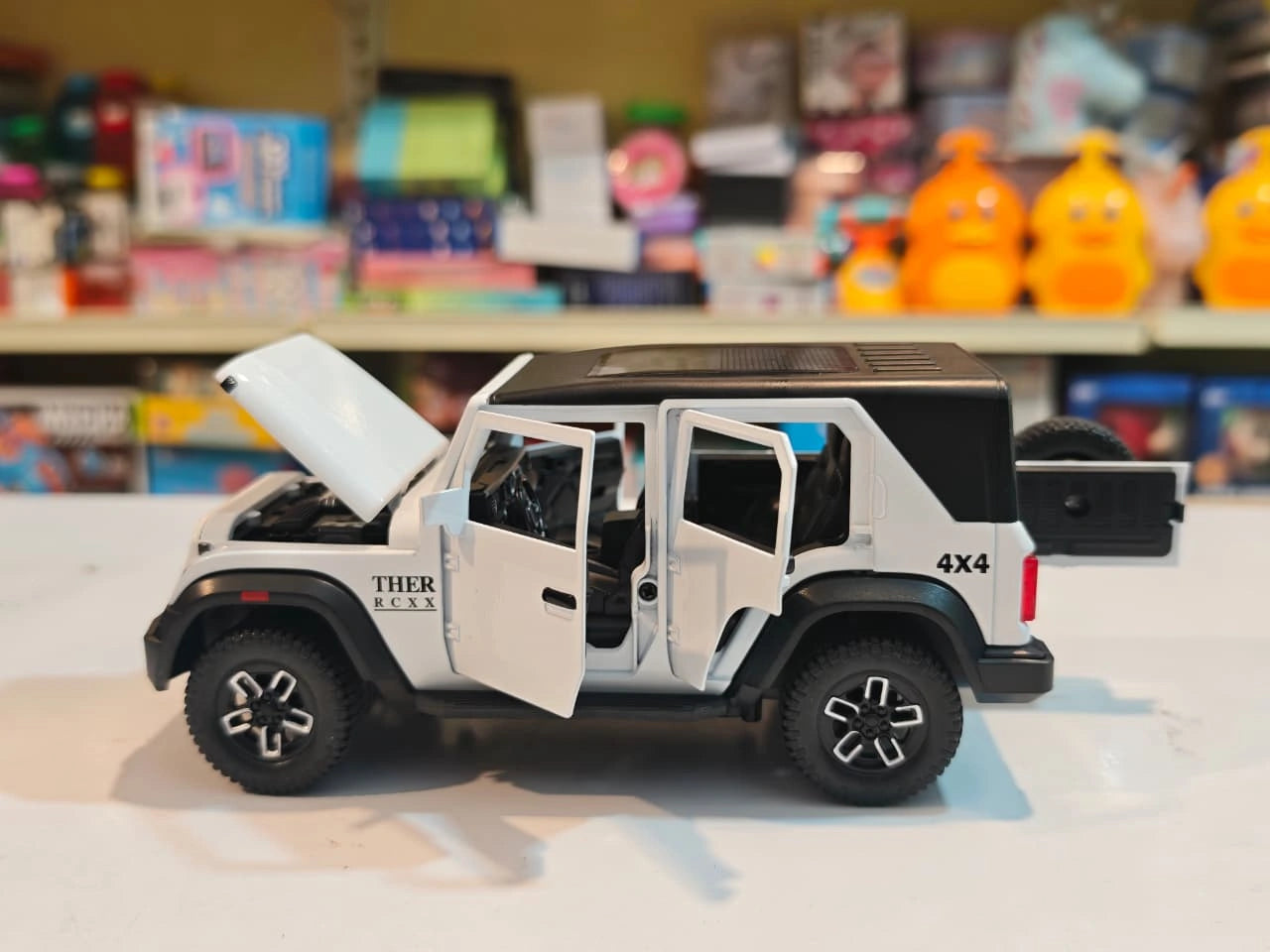 ThaarR Roxx 1:22 scale remote control 4x4 SUV with smoke spray effect, LED lights, opening doors and bonnet available at Toy Trendz by JJR Mart.