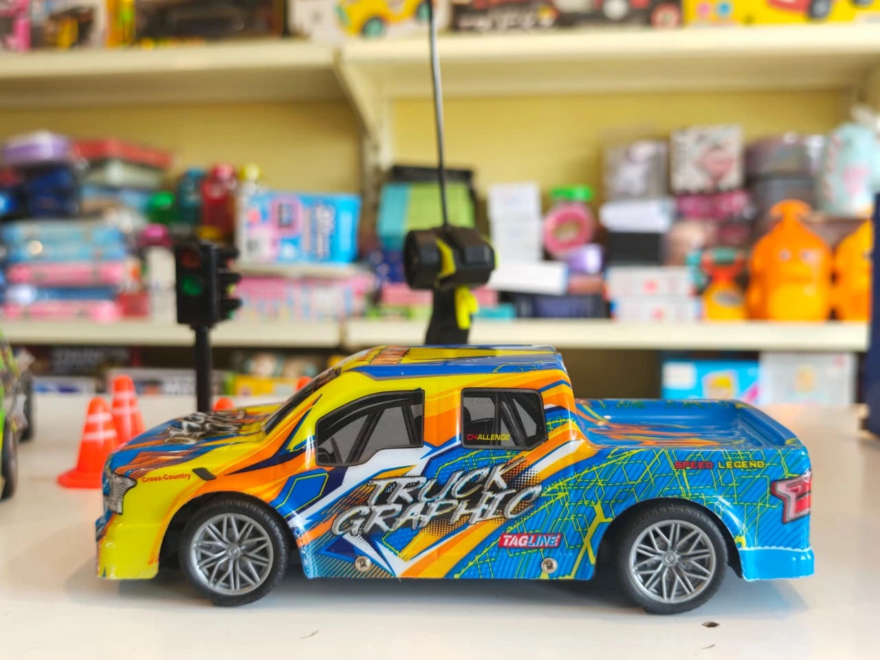 ToyBoi RC Racing Pickup Truck Set featuring two off-road racing trucks, traffic cones, signal light accessories, LED lights and remote control action available at Toy Trendz by JJR Mart Thoothukudi.