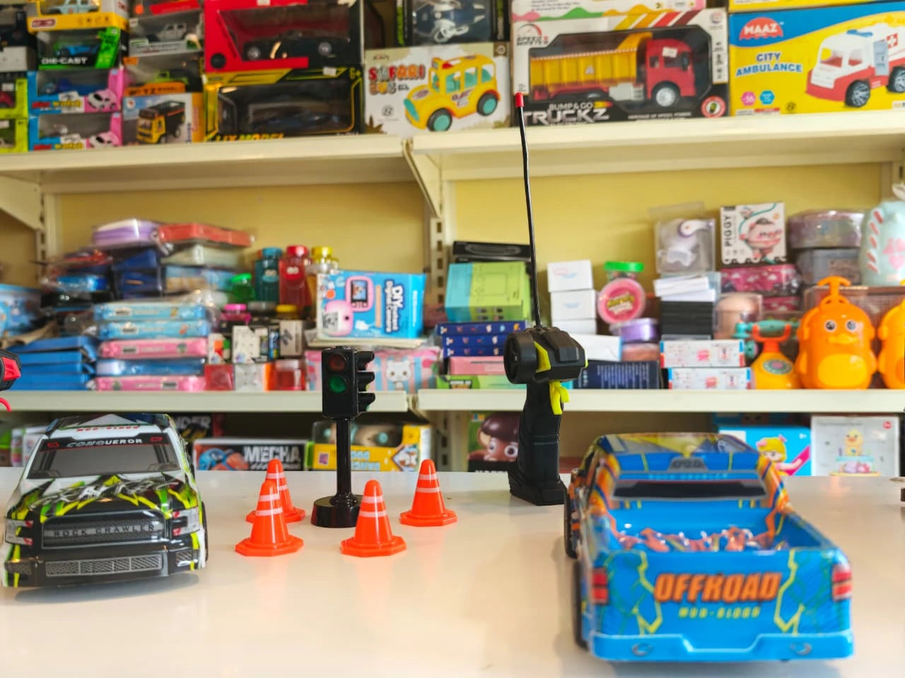 ToyBoi RC Racing Pickup Truck Set featuring two off-road racing trucks, traffic cones, signal light accessories, LED lights and remote control action available at Toy Trendz by JJR Mart Thoothukudi.