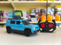 ToyBoi RC Adventure SUV Blue 1:18 scale remote control model car with realistic SUV styling, LED lights, roof carrier and easy-to-use controller available at Toy Trendz by JJR Mart Thoothukudi.