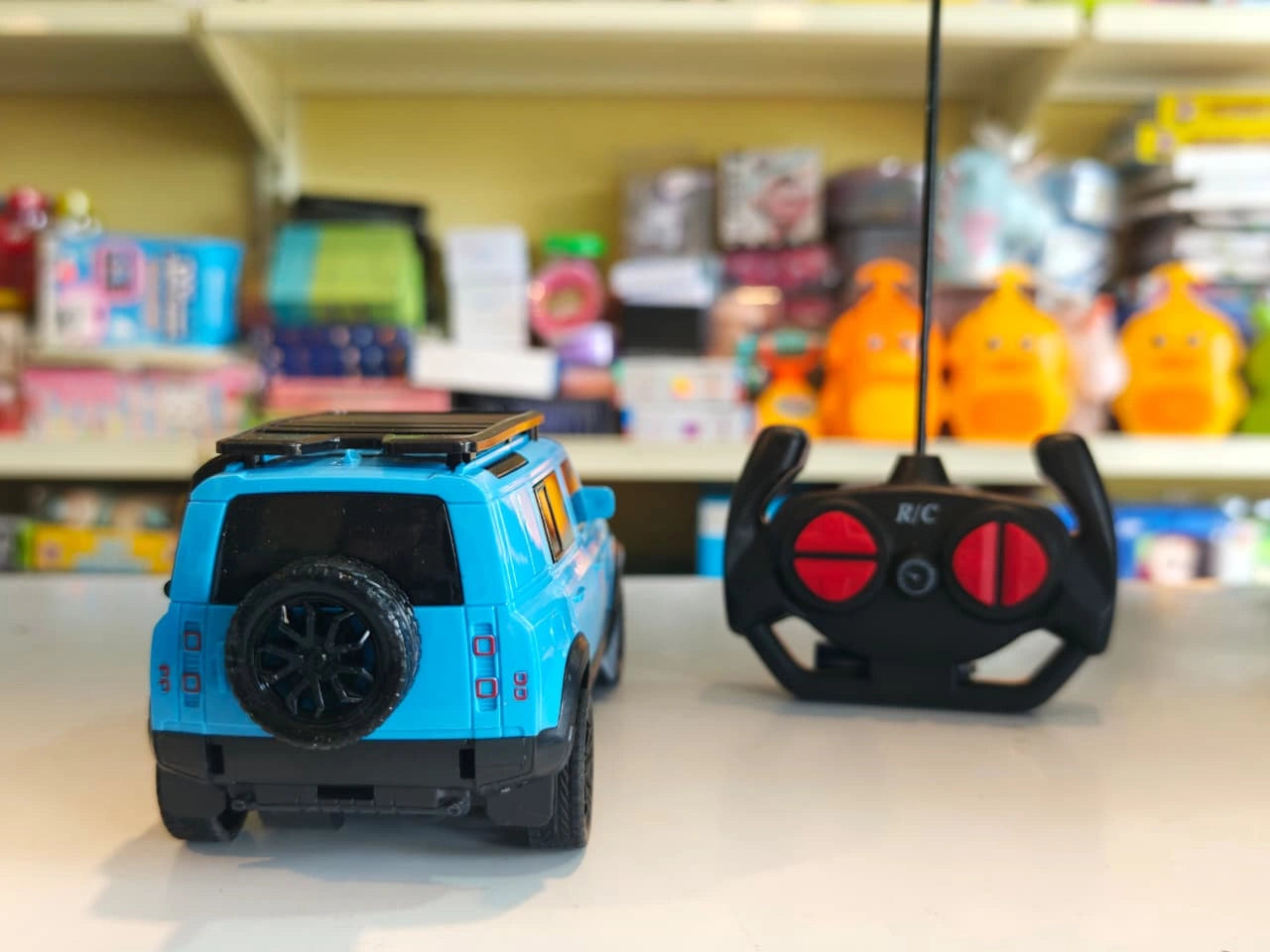 ToyBoi RC Adventure SUV Blue 1:18 scale remote control model car with realistic SUV styling, LED lights, roof carrier and easy-to-use controller available at Toy Trendz by JJR Mart Thoothukudi.