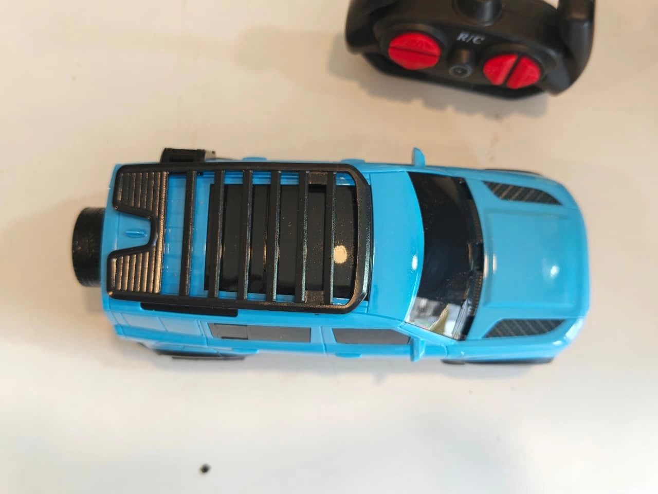 ToyBoi RC Adventure SUV Blue 1:18 scale remote control model car with realistic SUV styling, LED lights, roof carrier and easy-to-use controller available at Toy Trendz by JJR Mart Thoothukudi.