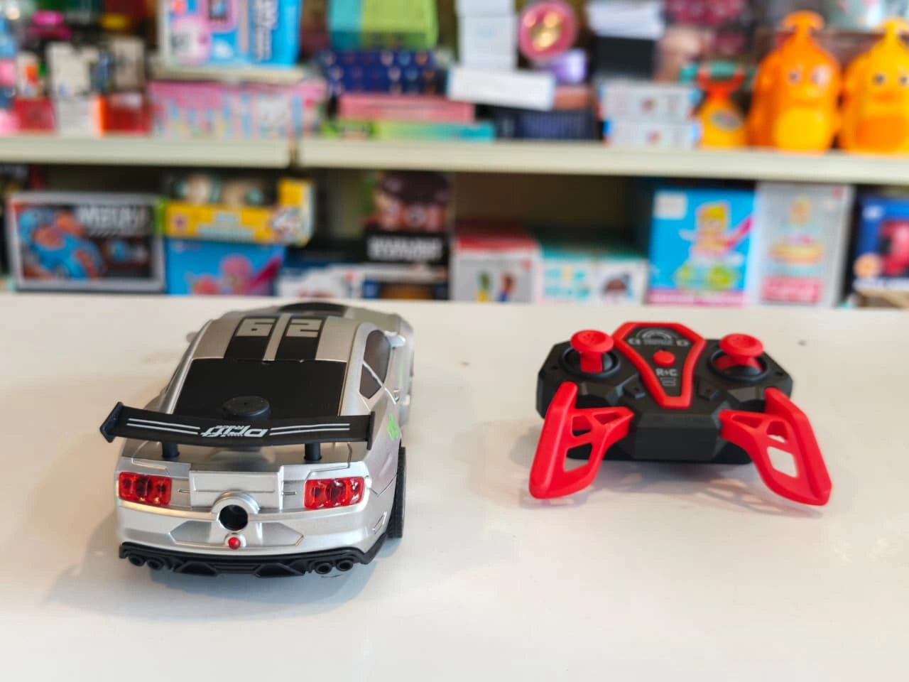 ToyBoi RC Turbo Spray Drift Car with realistic mist spray effect, LED lights, high-speed drifting and 2.4GHz remote control available at Toy Trendz by JJR Mart Thoothukudi.