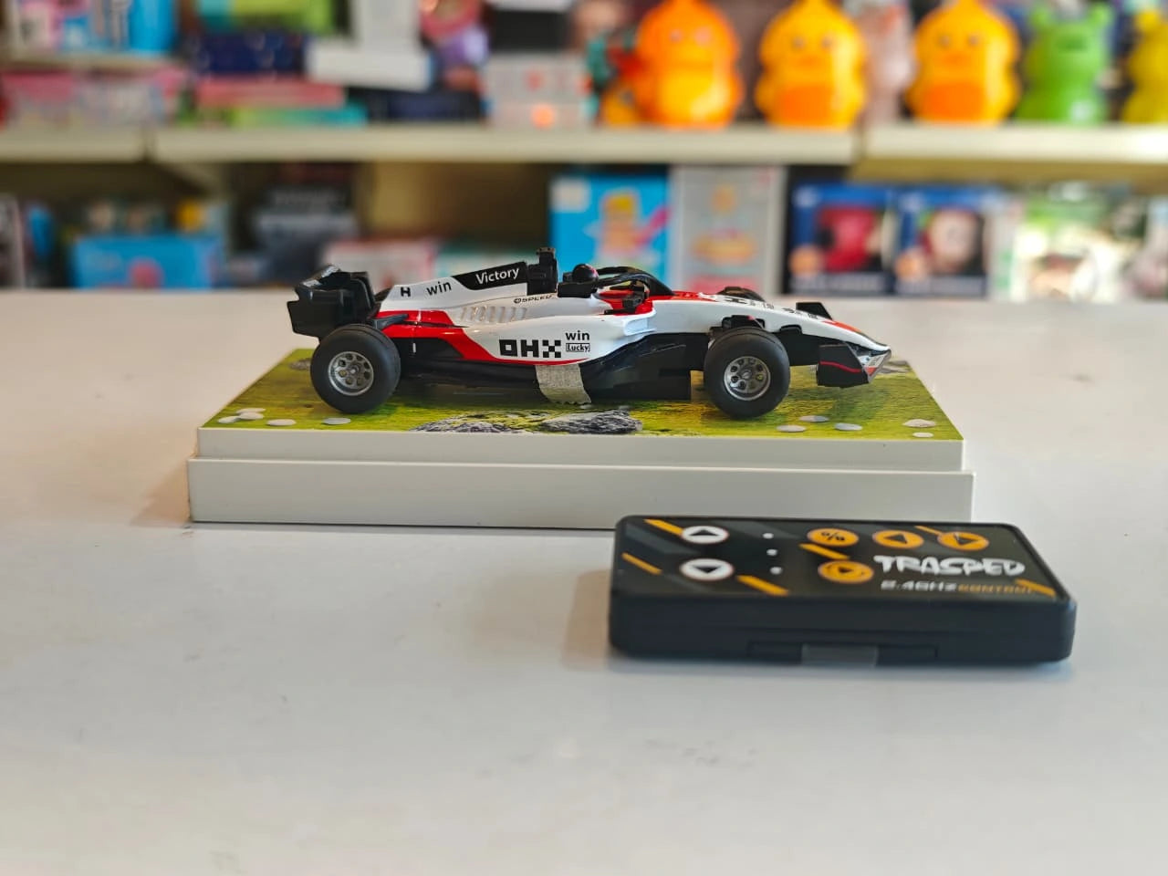 Mini Formula RC Racing Car featuring Formula racing design, 2.4GHz remote control, alloy body, LED lights and rechargeable battery available at Toy Trendz by JJR Mart Thoothukudi.