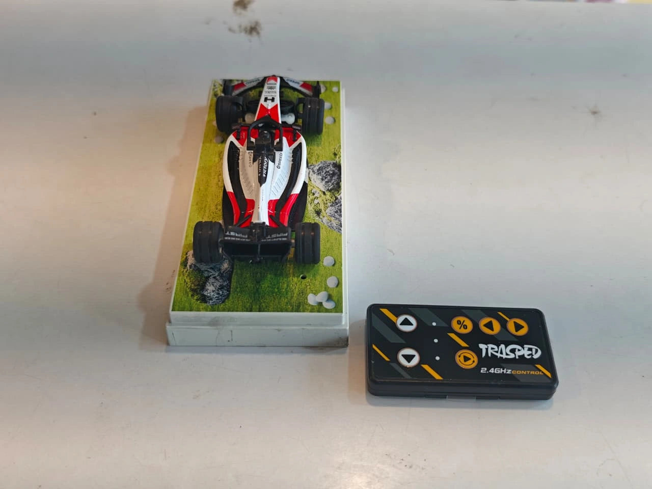 Mini Formula RC Racing Car featuring Formula racing design, 2.4GHz remote control, alloy body, LED lights and rechargeable battery available at Toy Trendz by JJR Mart Thoothukudi.