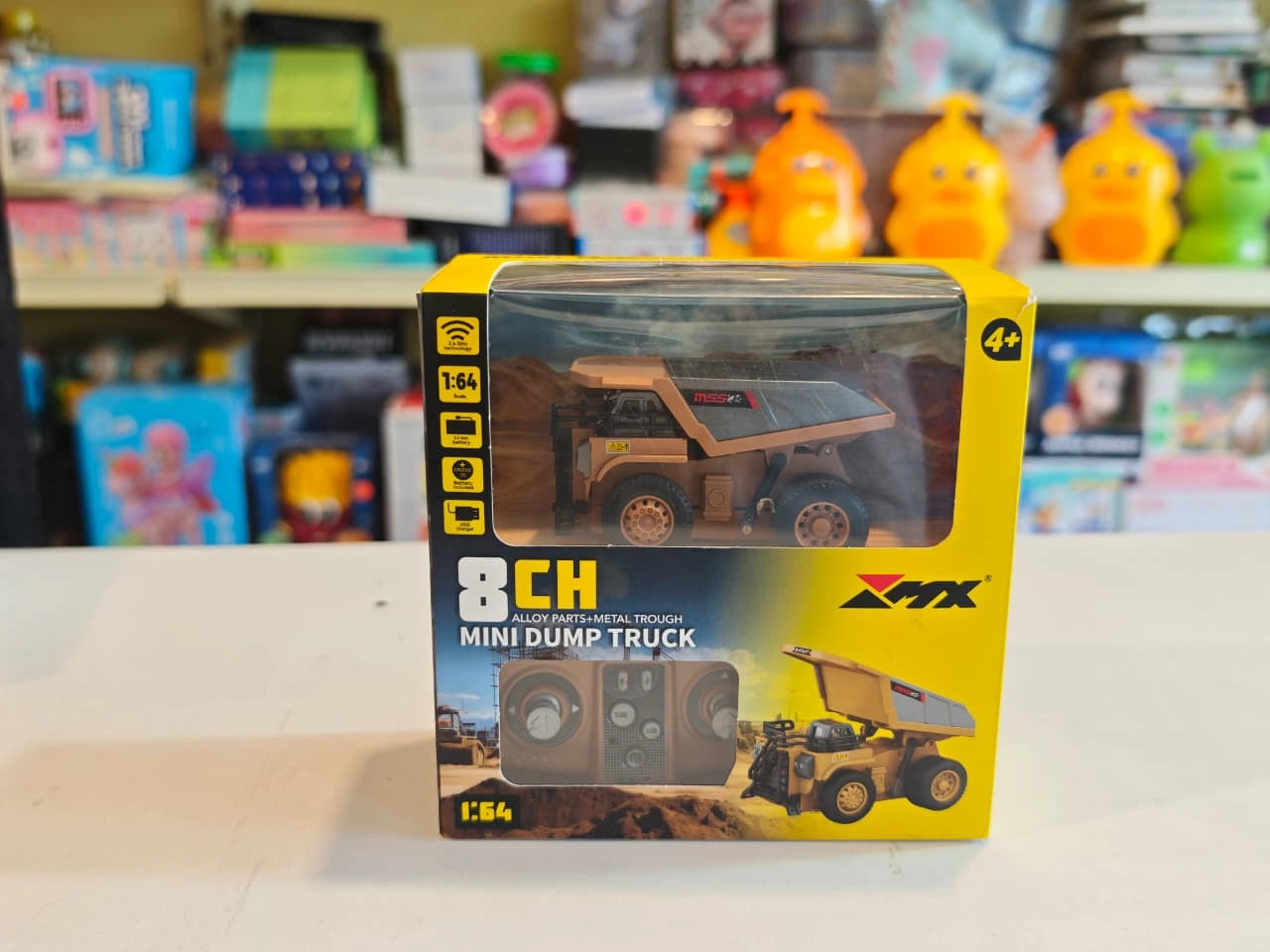 Mini RC Dump Truck featuring working dump bed, LED headlights, 2.4GHz remote control, realistic construction vehicle design and alloy parts available at Toy Trendz by JJR Mart Thoothukudi.