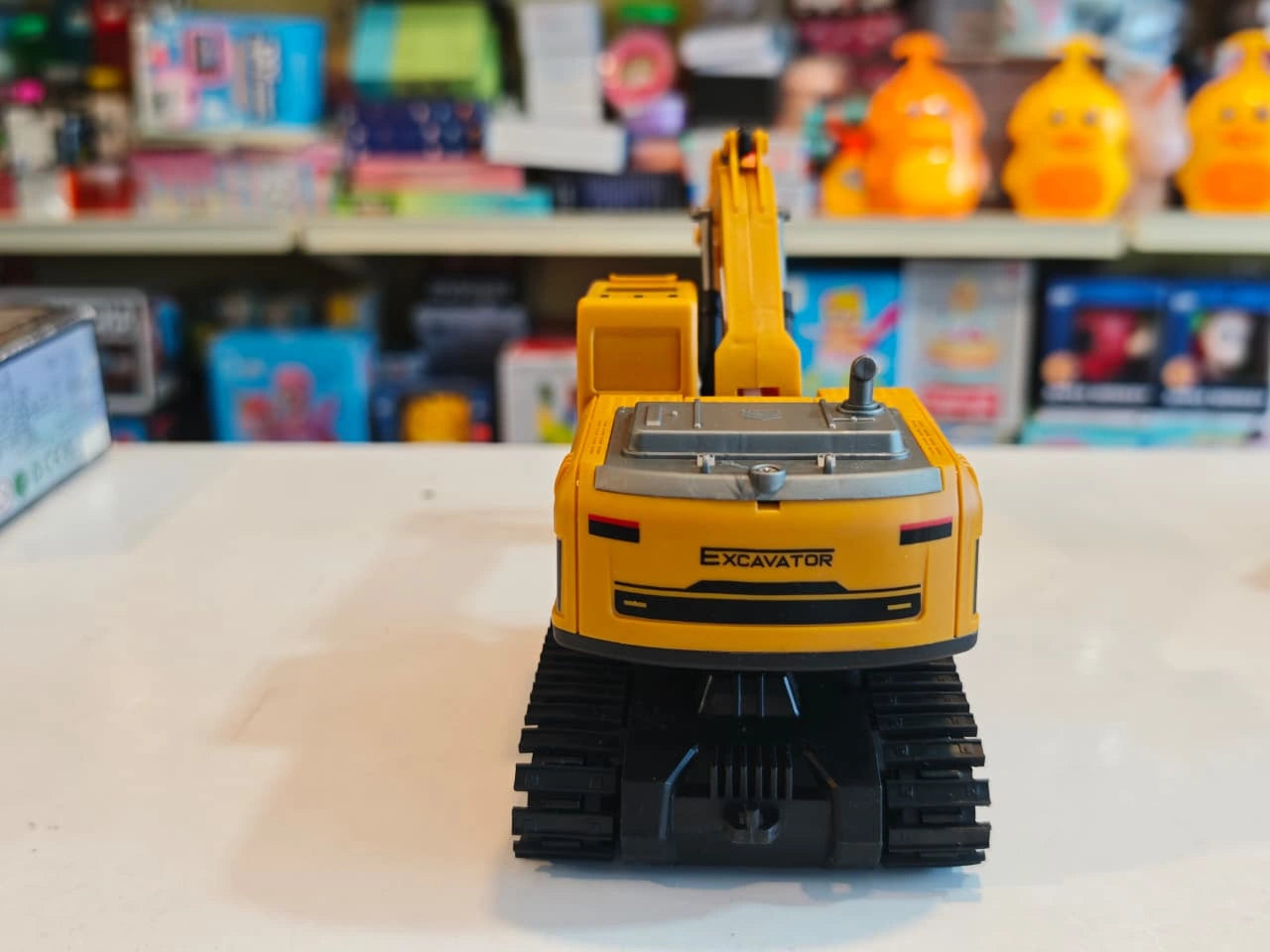 Remote Control Engineering Excavator with tracked wheels, movable digging arm, detachable dump trailer and wireless controller available at Toy Trendz by JJR Mart Thoothukudi.