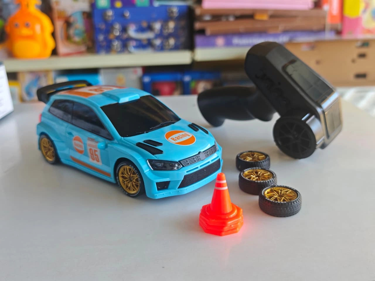 ToyBoi RC Rally Spray Drift Car 4WD with LED lights, drift wheels, spray effect, 2.4GHz controller and traffic cone accessories.