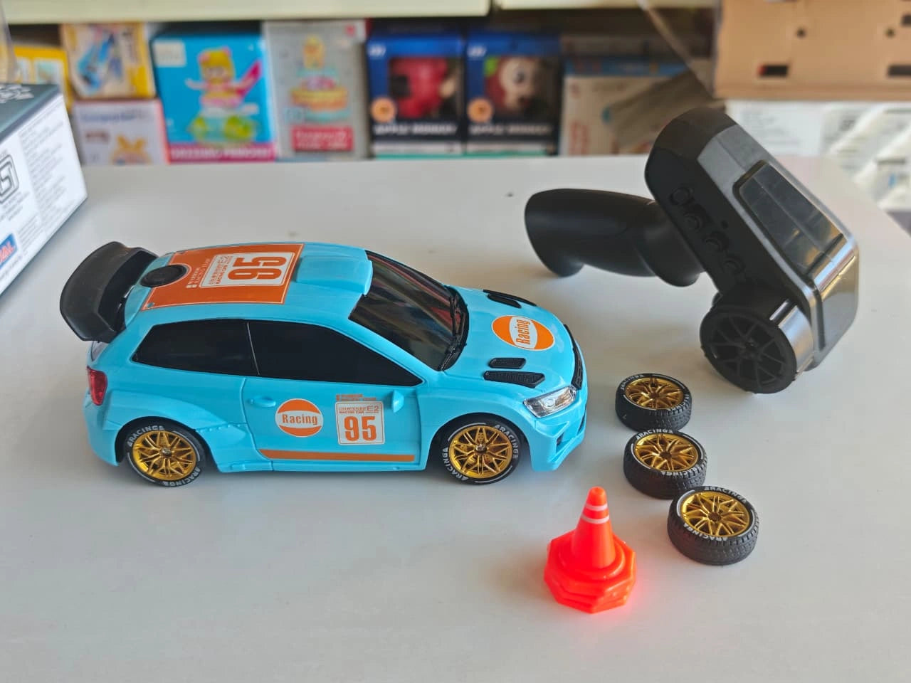 ToyBoi RC Rally Spray Drift Car 4WD with LED lights, drift wheels, spray effect, 2.4GHz controller and traffic cone accessories.